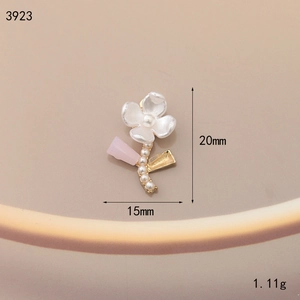 Detailed close-up of 20mm floral enamel alloy charm with pearl core for DIY jewelry