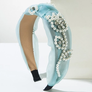 Light blue mesh headband with pearl and crystal floral design featuring a top knot