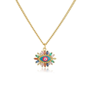 Macro view of 18K gold plated evil eye pendant with colorful zirconia and blue enamel