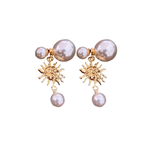 French vintage sun pearls earrings in gold finish with bohemian double pearl design