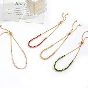 Detail of adjustable gold box chains with colorful zircon crystals in four vibrant colors