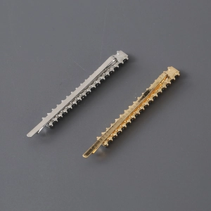 Slender gold and silver hairpins with jagged edges and black rhinestones for women