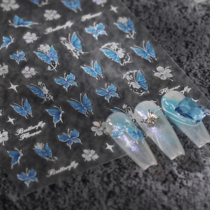 Holographic butterfly and flower nail stickers with blue silver glitter effect