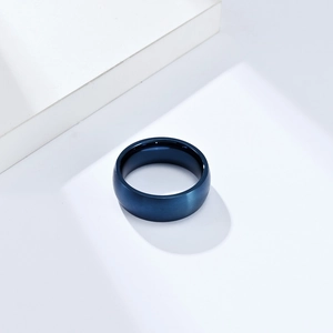 Detailed close-up of blue matte brushed titanium steel ring with smooth inner arc finish