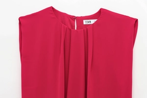 Detail of the pleated crew neckline on this rose pink sleeveless summer jumpsuit