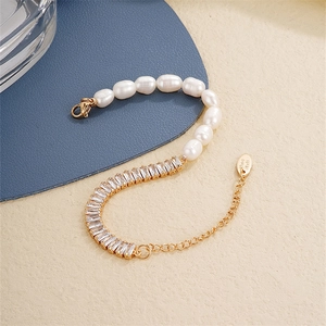 Elegant gold plated chain bracelet with white pearls and sparkling zircon stones