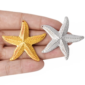 Handheld view of 304 stainless steel starfish pendants in gold and silver finishes
