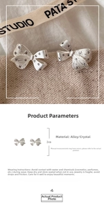 Detailed macro view showing a 2cm silver bow earring with shimmering inlaid crystals