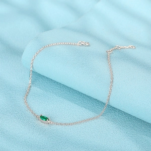 Detail of S925 sterling silver chain with marquise-cut green zircon and adjustable clasp