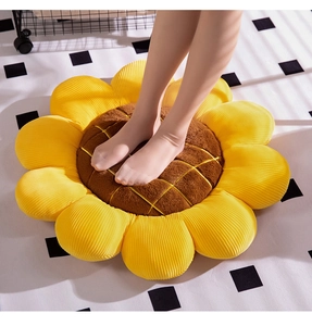 Detailed texture of sunflower seat cushion showing soft corduroy petals and grid stitching