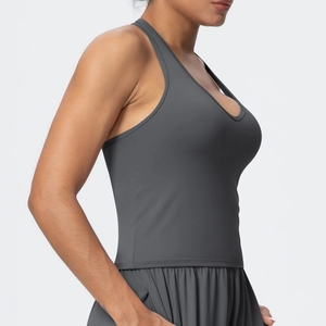 Close-up of matte dark gray V-neck sports bra with racerback design for yoga