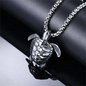Silver turtle pendant necklace with detailed shell texture on a thick square link chain