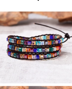 Detail of bohemian multi-layer wrap bracelet with colorful crystal beads and leather cord