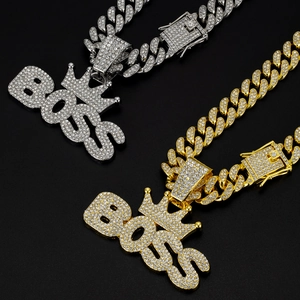 Hip hop style gold and silver BOSS crown pendants on iced out Cuban link chains
