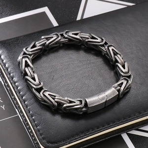 Detail view of silver Byzantine chain bracelet with vintage V-shaped links on black leather
