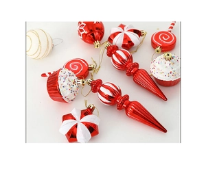 Close-up of red and white Christmas ornaments including candy, cupcake and striped ball shapes