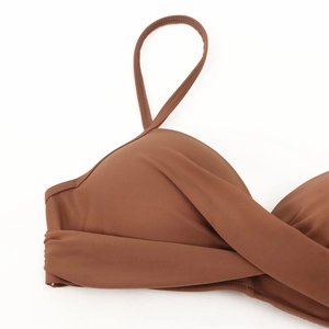 Brown high waist bikini top featuring crossover knot design and adjustable thin straps