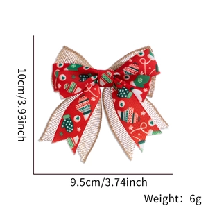 Detail view of 10cm Christmas linen and red ribbon bow with festive snowflake patterns
