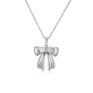 Close-up of a polished silver bow pendant necklace with a sleek and dainty link chain