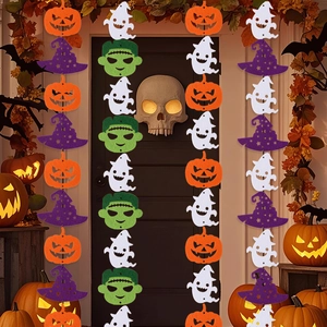 Vertical Halloween felt garlands featuring pumpkins ghosts and witch hats on a dark door