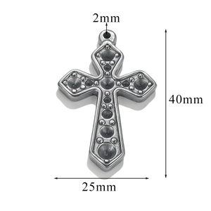 Detail view of a vintage silver cross pendant with dimensions 40mm by 25mm