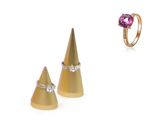 Detailed macro view of purple gemstone ring on golden cone jewelry display stand