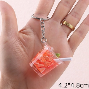 Detailed close-up of a 4.2x4.8cm mini strawberry drink keychain with realistic ice cubes