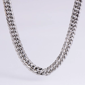 Macro shot of polished silver stainless steel thick Cuban link chain necklace