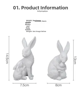Détail des figurines de lapins en résine blanche mesurant 14,5 cm et 13 cm de haut