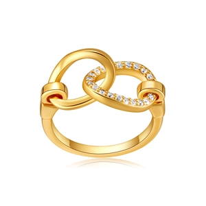 Detail view of interlocking golden bow ring with micro-pave cubic zirconia settings