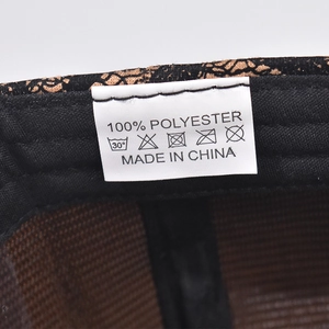 Detailed view of the 100% polyester wash care label and interior lining of the leopard cap