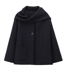 Detailed view of dark blue short coat with integrated scarf collar and large pocket