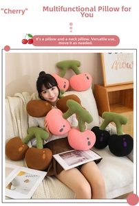 Detail showing plush cherry-shaped neck pillows in pink, brown, and black velvet fabric