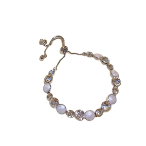 French palace style silver bracelet with white pearls and clear crystals on white background
