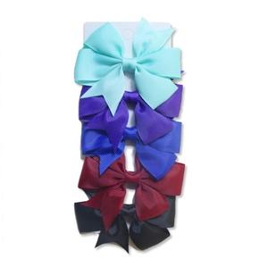 Detailed set of five solid color ribbed ribbon fishtail bow hair clips on white card