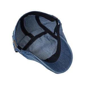 Internal structure of a vintage blue washed cotton denim flat cap with 100% cotton label
