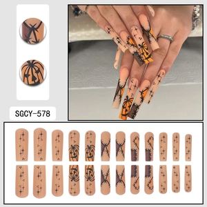 Halloween long coffin press-on nails with pumpkin, star, and stitch patterns
