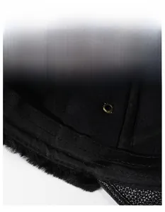 Detail of wide moisture-wicking sweatband and thick faux fur lining in winter leather cap