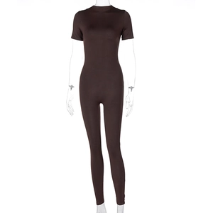Detail of dark brown ribbed knit fabric on short sleeve full length yoga jumpsuit