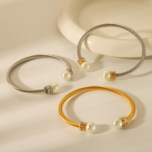 Twisted stainless steel cable bracelets in gold and silver with pearls and crystals