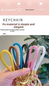 Detail of woven PU leather keychains in multiple colors with zinc alloy metal clasps