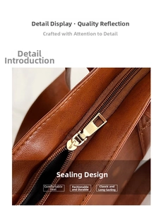 Close-up of golden metal zipper and textured brown PU leather on a large tote bag