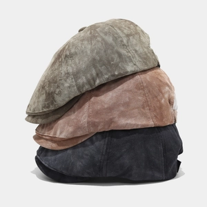 Fashionable tie-dye newsboy caps in military green, brown, and charcoal grey canvas