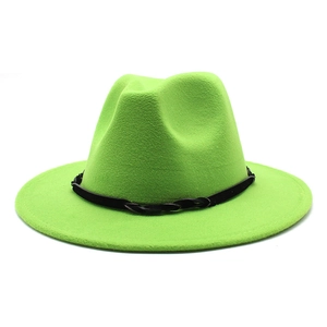 Detail of vivid green wool felt jazz hat featuring a black woven decorative band