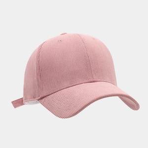 Detail of pink corduroy baseball cap showing fine ribbed texture and adjustable back strap