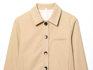Detail of khaki jacket with lapel collar, four-button closure and stitched breast pocket