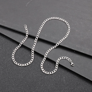 Detailed top view of silver stainless steel Cuban link chain with lobster clasp