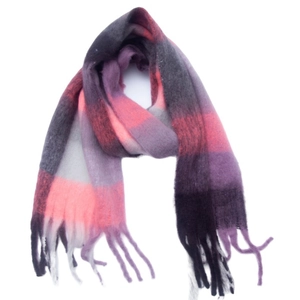 Close-up of soft brushed knit texture on pink and grey plaid scarf with long fringe