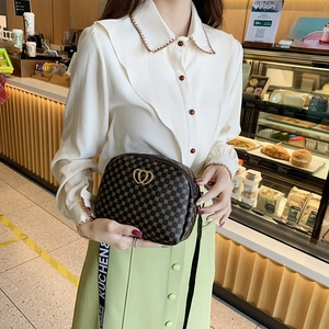 Polka dot shell bag with golden heart hardware and wide canvas shoulder strap