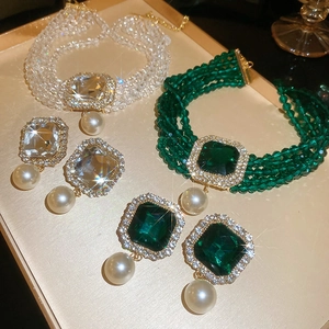 Detailed macro view of vintage choker necklace set with crystal pendants and pearls
